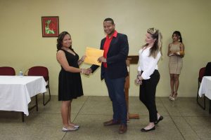 Faith Wong recieving her Safe Zone Diploma from Fantasy Carnival's Ian Royer and Shannon Hutchinson at the programme's graduation ceremony at the YMCA, Wrightson Road, Port of Spain, on Saturday July 15, 2017. 