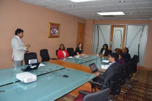 (Standing left) Director of the Trinidad and Tobago Fine Cocoa Company,  Ashley Parasram, shares an overview of the company’s operations and opportunities for partnership, during a meeting with (fourth from left) Trade and Industry Minister, Paula Gopee-Scoon and members of the ministry's technical staff, during an August 15 meeting at the ministry's offices, Nicholas Tower, Port-of-Spain. This was the latest in a series of meetings being held by the ministry to examine new and innovative opportunities to boost exports and increase access to markets in agro processing. PHOTO COURTESY THE TRADE AND INDUSTRY MINISTRY.
