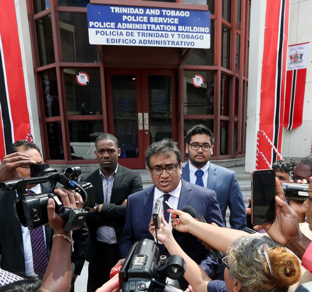 BLANKED: Attorney Jagdeo Singh and other attorneys speak with reporters outside the Police Administration Building in Port of Spain yesterday after they were denied the opportunity to meet former attorney general Anand Ramlogan who was being questioned by police.