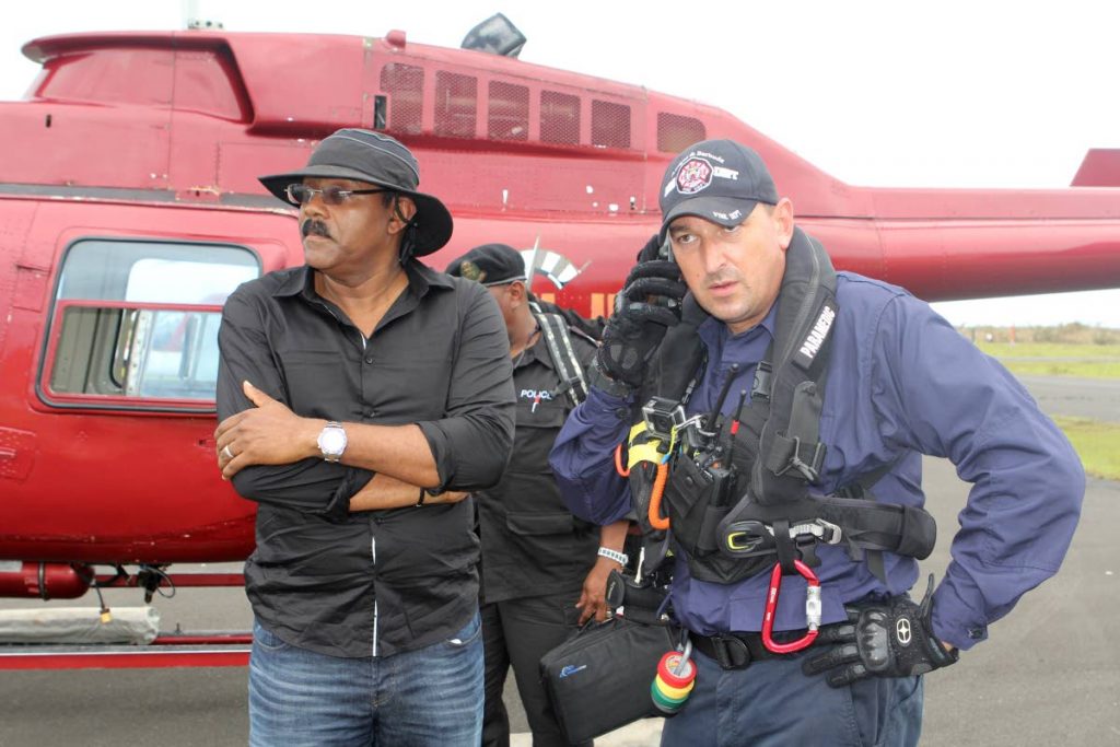 In this file photo, Antigua and Barbuda Prime Minister Gaston Browne with a fire department officer.