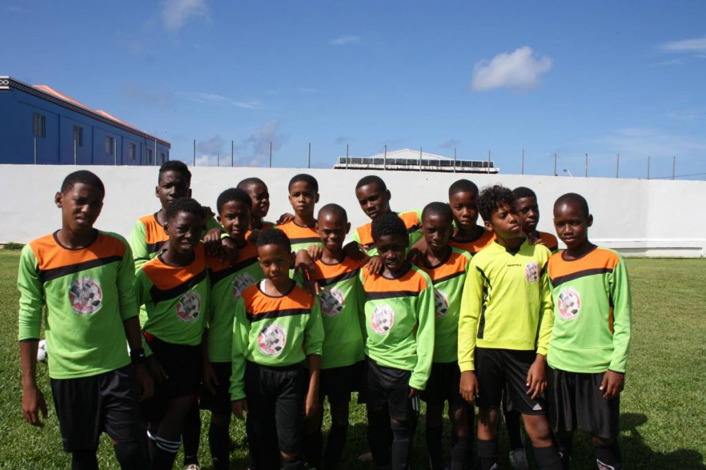 Members of T&T Maestros Institute U-13 team pose for a team photo in St Vincent recently.
