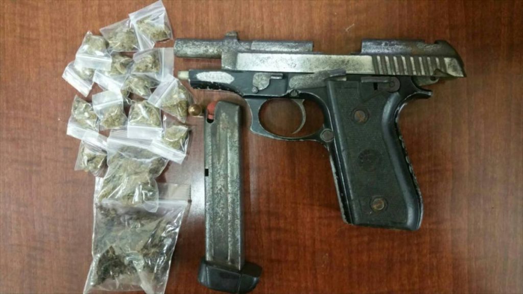 Items seized include a Taurus pistol, one round of 9mm ammunition and a quantity of plastic packets containing 26 grams of marijuana. 
