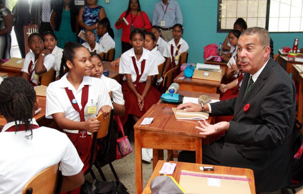 President Anthony Carmano speaks with students of the Holy Faith Convent, Penal yesterday during a visit to the school. The President warned students against their posts on social media.