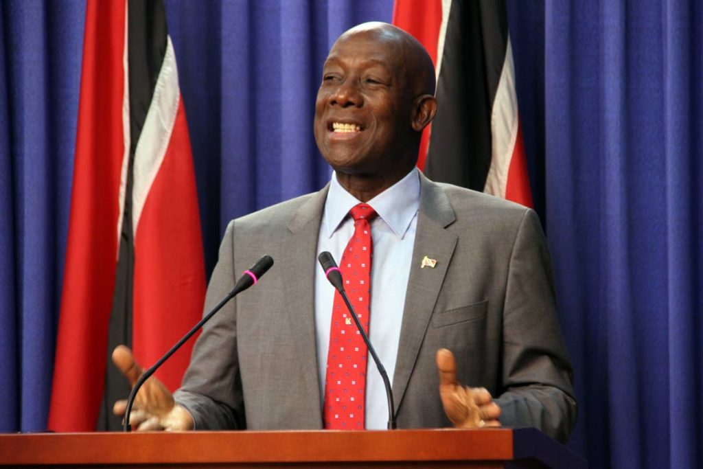 HAPPY MOOD: Prime Minister Dr Keith Rowley smiles as he addresses reporters yesterday at the post Cabinet press briefing at the Diplomatic Centre in St Ann’s.
