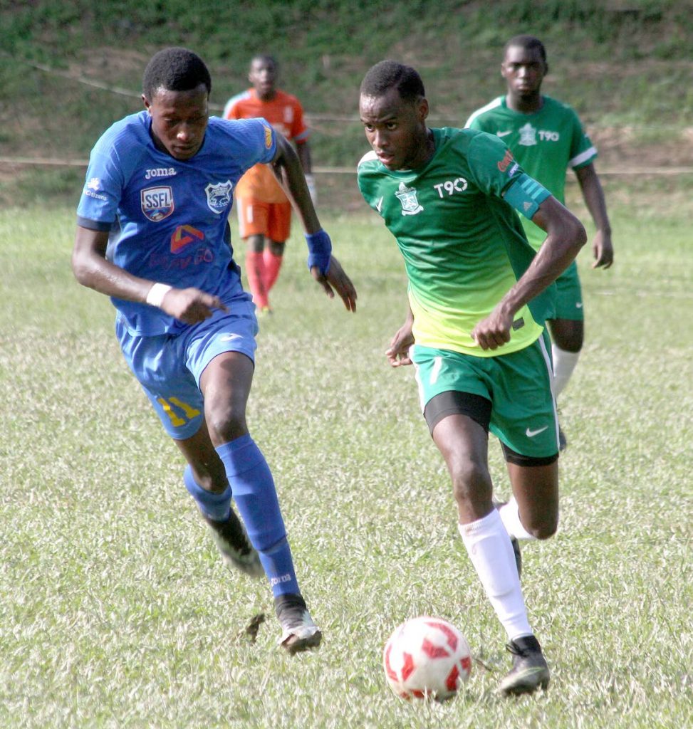 Trinity's Saleem Henry and Speyside's Stephon Antoine go head to head at the Secondary Schools Football League match between the two schools at Trinity Grounds in Moka