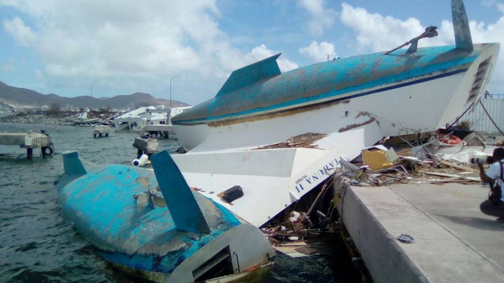 Capsized ships along St Maarten’s Cole Bay, just opposite the Princess Julianna International Airport yesterday. PHOTO BY SHANE SUPERVILLE