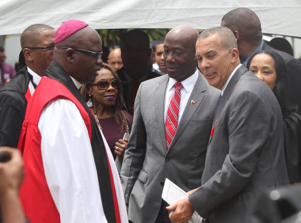 (Clockwise from left) Bishop Claude Berkley, Chief Justive Ivor Archie, Prime Minister Keith Rowley and President Anthony Carmona share a light moment after a service at the Holy Trinity Cathedral yesterday for the opening of the new law term 2017-2018.