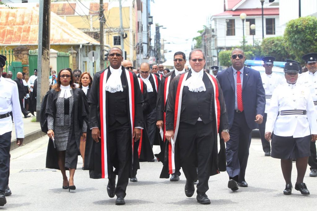 NEW LAW TERM: Chief Justice Ivor Archie, left, leads judges from a service at the Holy Trinity Cathedral  yesterday to the Hall of Justice as part of the opening ceremony of the new law term.