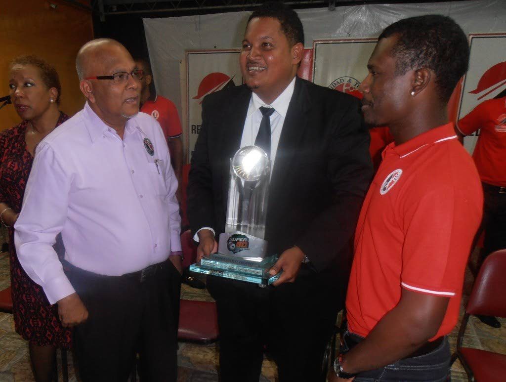 FLASHBACK: TT Cricket Board president Azim Bassarath, left, poses with Sports Minister Darryl Smith, centre, and cricketer Jason Mohammed.