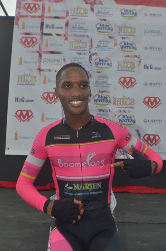 Jamol Eastmond celebrates after winning his race at the Michael Phillips Republic Day Cycling Classic, at the Diego Martin Highway, Diego Martin yesterday.
