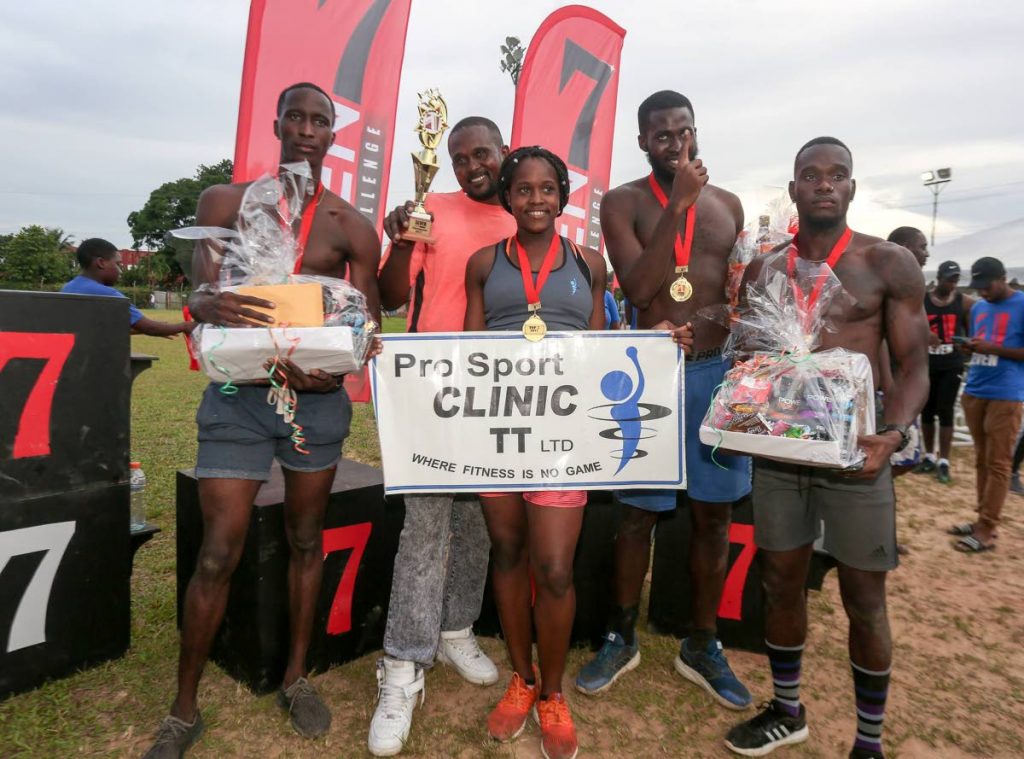 Spartans, champions of the SEVEN Fitness Challenge, (from left) Kerrem Sealy, Antonia Sealy, Aaron Julien and Jeron Emanis pose with their trophy, medals and hampers.
