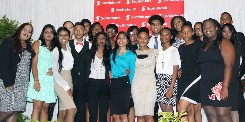 ALL SMILES AT AWARDS CEREMONY: (Far left) Cindy Mohammed, Manager - Public and Corporate Affairs, Sponsorship and Philanthropy, Marketing Department at Scotiabank TT, happily poses for a group photo with the 19 secondary school students who participated in the inaugural Scotiabank Vision Achiever Youth Programme, during the programme's Awards and Closing Ceremony, Hyatt Regency, Port-of-Spain on September 21, 2017. PHOTO BY STEFFON DOUGLAS.