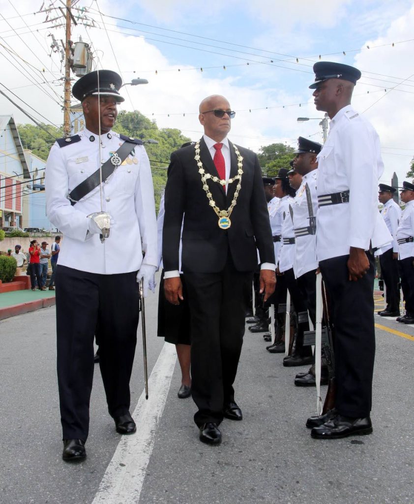 NOT HAPPY: San Fernando Mayor Junia Regrello inspects the guard of honour formed by members of the San Fernando City Municipal Police during his inauguration in December last year.   PHOTO BY VASHTI SINGH