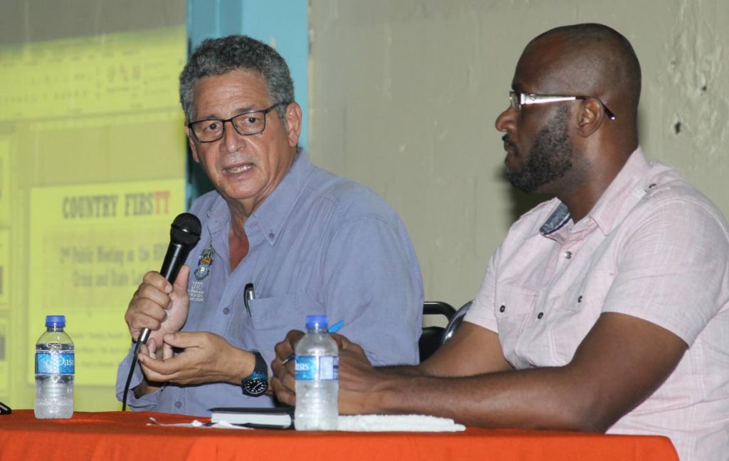 (Left to right) Professor of Applied Economics, Patrick Watson and Country FirsTT's Founder and Lead Activisit, Daren Mc Leod, speaking at the group's 