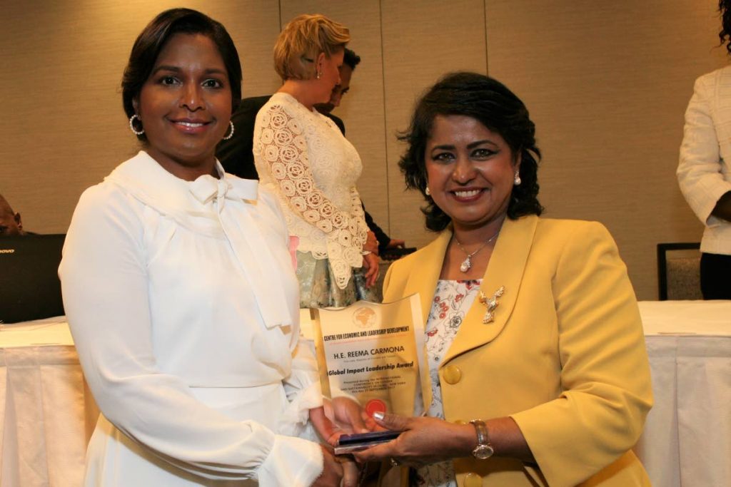 President of Mauritius Ameenah Gurib presents Reema Carmona with the Global Female Impact Leadership Award at the Centre of Economic and Leadership Development awards ceremony at the Midtown Hilton in New York on September 21. Photos courtesy Office of the President