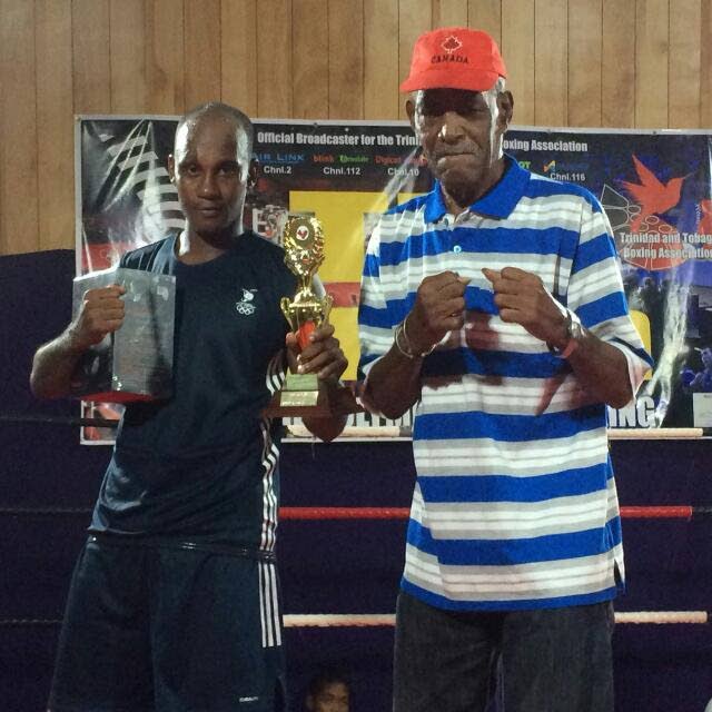 Kyleron Ruiz, left, won the fighter of the night award at a boxing card in Marabella, on Saturday. Next to Ruiz is Roy Harry, former national welterweight middleweight boxer who debuted in 1968 and hails from Marabellla.