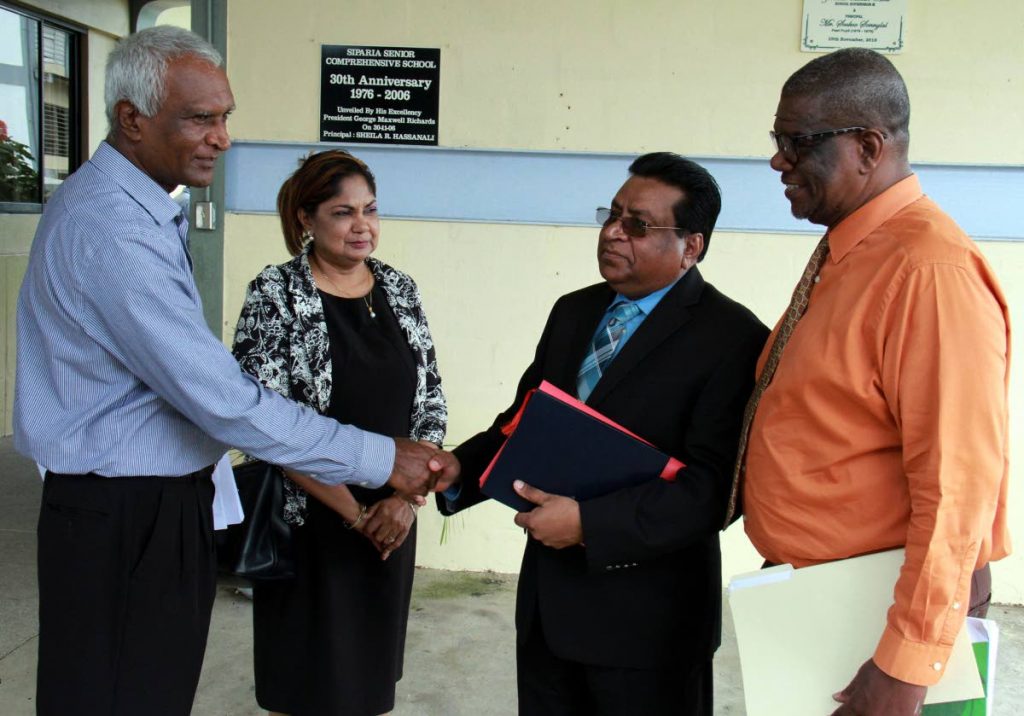 At left, Siparia West Secondary School principal Sookoo Sonnylal greets at center, Chief Education Officer Harrilal Seecharan while second left, School Supervisor III Zabeedah Hosein - Abid and at right, Act Director of School Supervision John Thompson looks on.
PHOTO BY ANIL RAMPERSAD.
