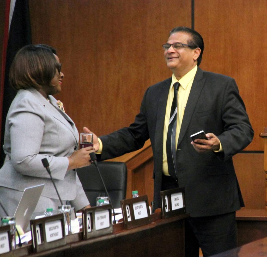 Minister of Planning Camille Robinson-Regis and Member of Parliament for San Juan/Barataria Faud Khan share a light moment during the budget debate yesterday. PHOTO BY SUREASH CHOLAI.