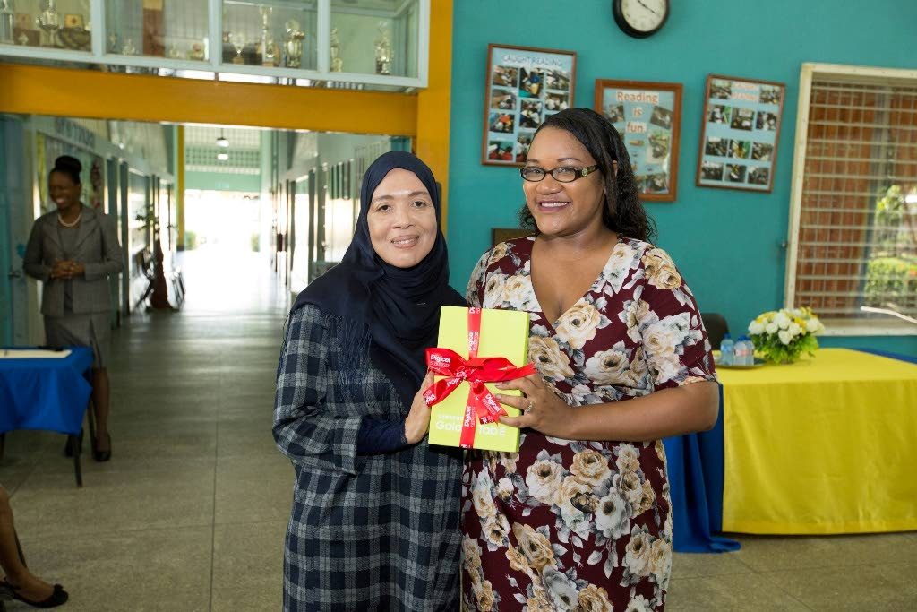 Zippy’s Friends 2016-2017 Teacher of the Year
Samantha Sooknanan (right) shares the moment with her co-worker at the St Augustine South 
Primary School.