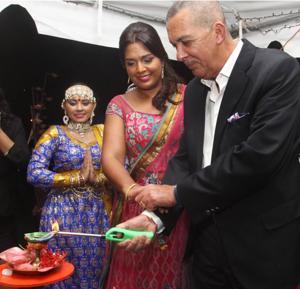 President Anthony Carmona and his wife Reema, light the first deya at his Divali Celebrations, President's Grounds, St. Anns. PHOTO BY ANGELO MARCELLE