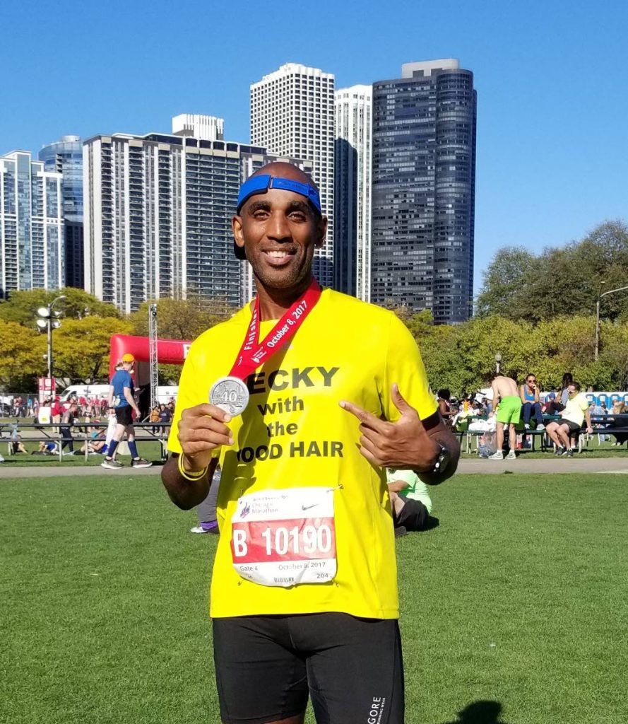 Dexter Webb shows off his Chicago Marathon medal