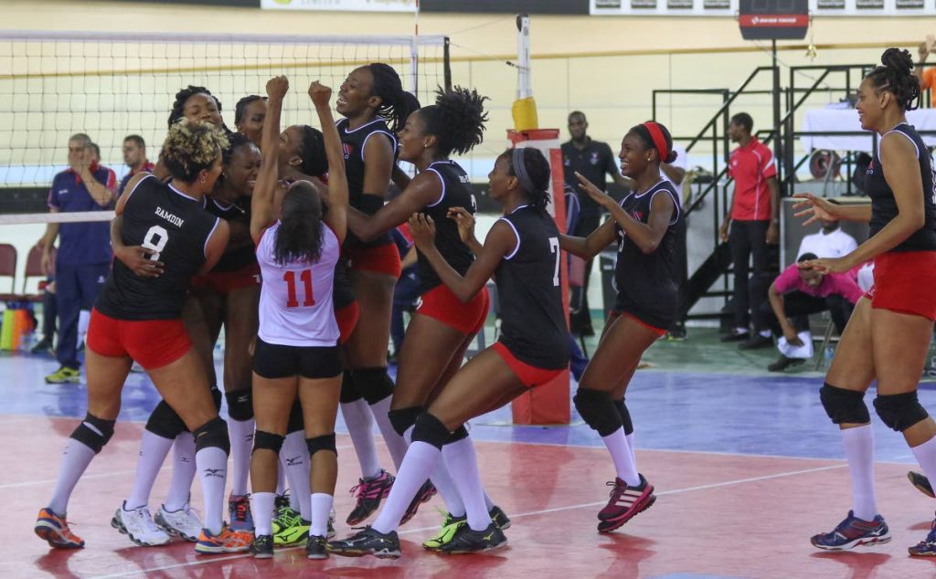 JAPAN HERE WE COME: Trinidad and Tobago’s women volleyballers celebrate victory against Costa Rica to book their spot at the World Championships next year.