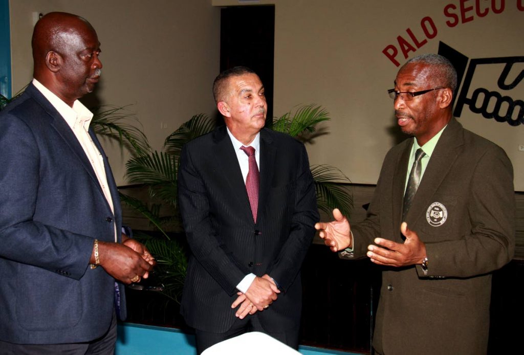 MONEY TALKS: Palo Seco Credit Union head Alvin Stephenson makes a point to President Anthony Carmona, centre, and President of the Co-Operative Credit Union League Joseph Remy during a function earlier this week.