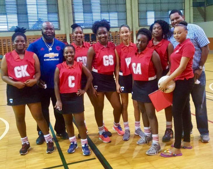 SPIHC team members, Minister of Sport Darryl Smith, right, and Councillor Paul Leacock pose for a photo before the start of the Chips SCC Under 21 Netball Tournament at the Eastern Regional Indoor Sporting Arena, Tacarigua. 