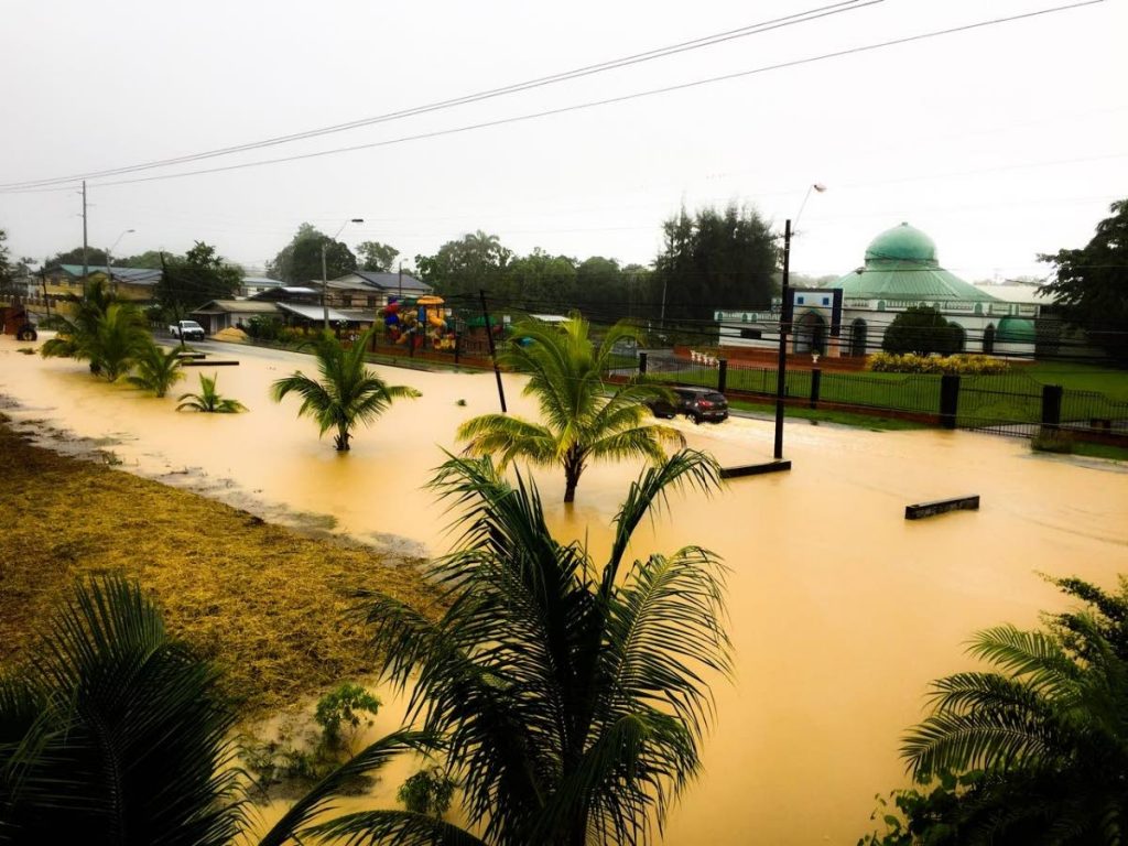 WATER EVERYWHERE: This photo, posted on
social media yesterday, shows brown water covering all of Rochard Road in Barrackpore as large sections of Trinidad saw widespread flooding
following heavy showers which started on Wednesday.