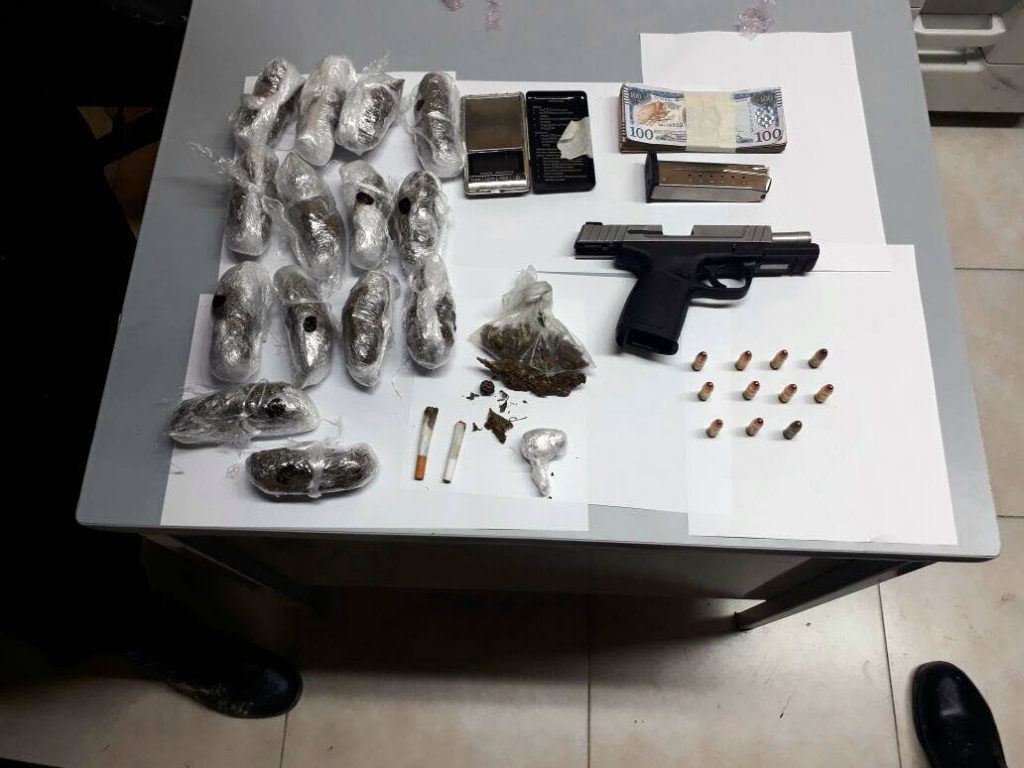 SEIZED: A pistol, ammunition, compressed marijuana and money believed to be the proceeds from the sale of illegal drugs, were seized by Eastern Division police who also arrested two men yesterday.