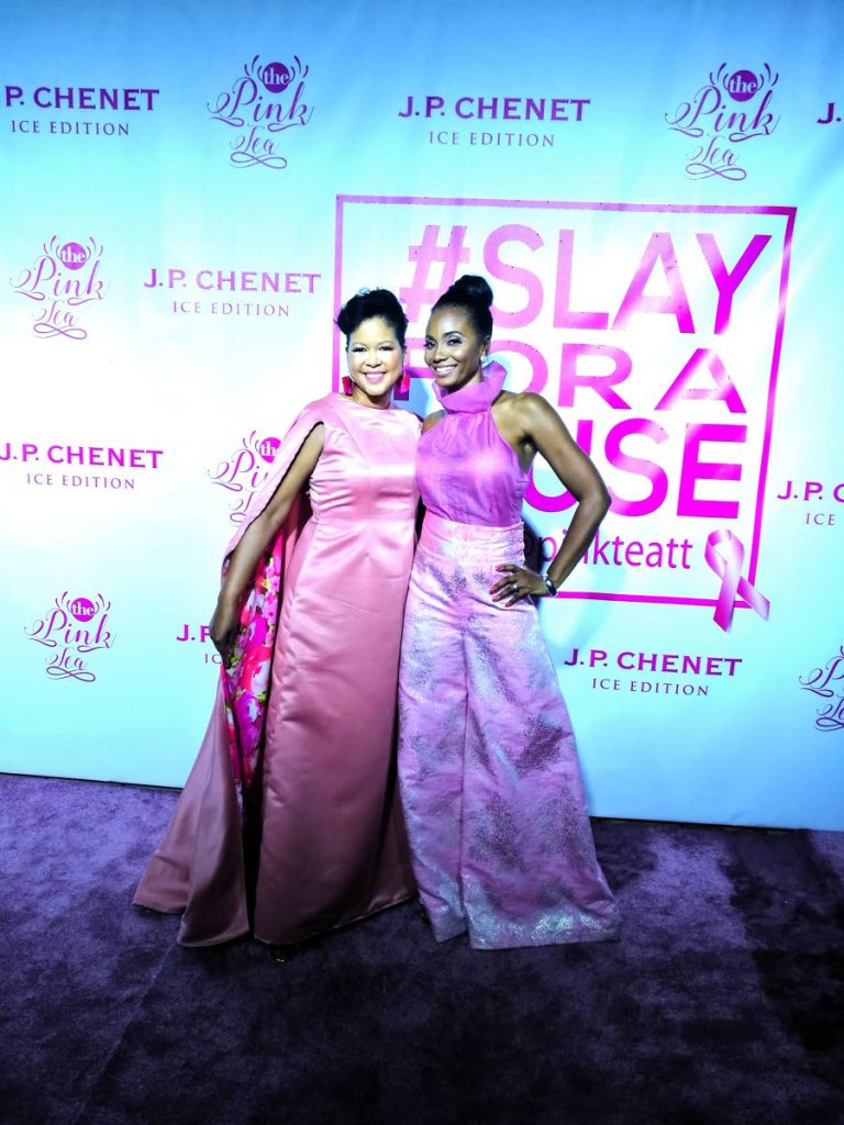 Pink Tea TT 2017: Cancer survivor, Keisha Butcher and organiser/host of Pink Tea TT, Danielle Jones-Hunte, pose for photos on the pink carpet of the second annual event, held at Chaud Cafe, One Woodbrook Place, St James on October 22. PHOTO BY SASHA HARRINANAN