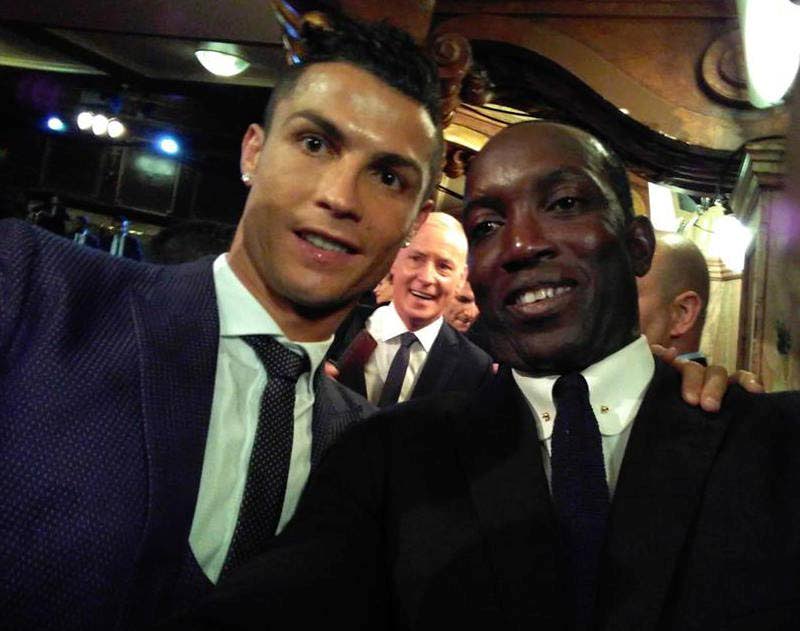 Dwight Yorke, right, takes a selfie with The Best FIFA Men’s Player Cristiano Ronaldo at the FIFA Awards yesterday in London.