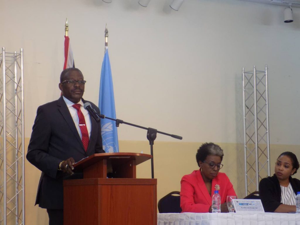 National Security Minister Edmund Dillon speaking at the launch of a two-day workshop on the World Drug Problem at the Police Training Academy in St James on Tuesday.  Looking on are head of the National Drug Council Esther Best and Bo Harris of the United Nations Office on Drugs and Crime.   PHOTO BY SHANE SUPERVILLE