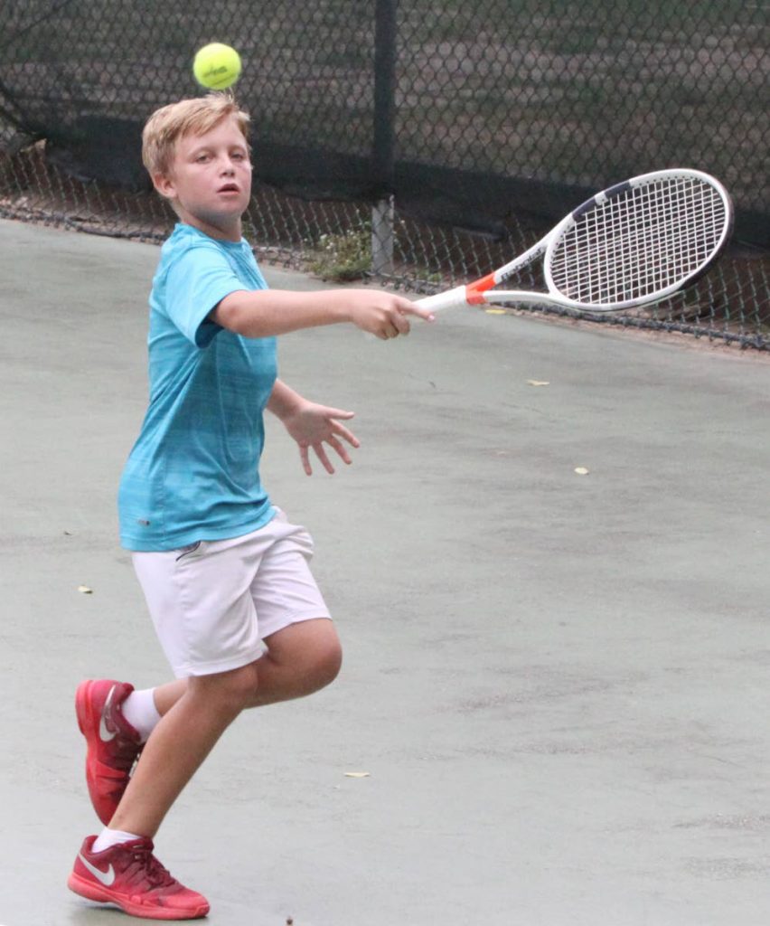 James Hadden in action at the Subway Junior Tennis Tournament at Trinidad Country Club, Maraval, yesterday.