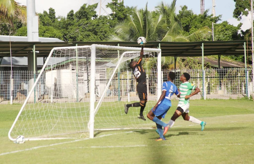 St Augustine goalkeeper Ajahri Murrien tips the ball over the bar against Presentation College in a Secondary Schools Football League match at Guaracara Park, Pointe-a-Pierre, yesterday.