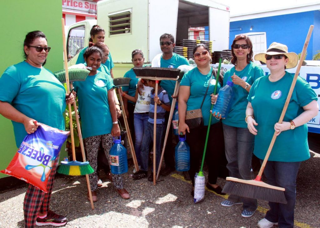 HELPING HANDS: These volunteers organised by the Spice Boys Foundation set out yesterday to provide relief and cleaning materials to citizens in south Trinidad who were affected by recent floods.