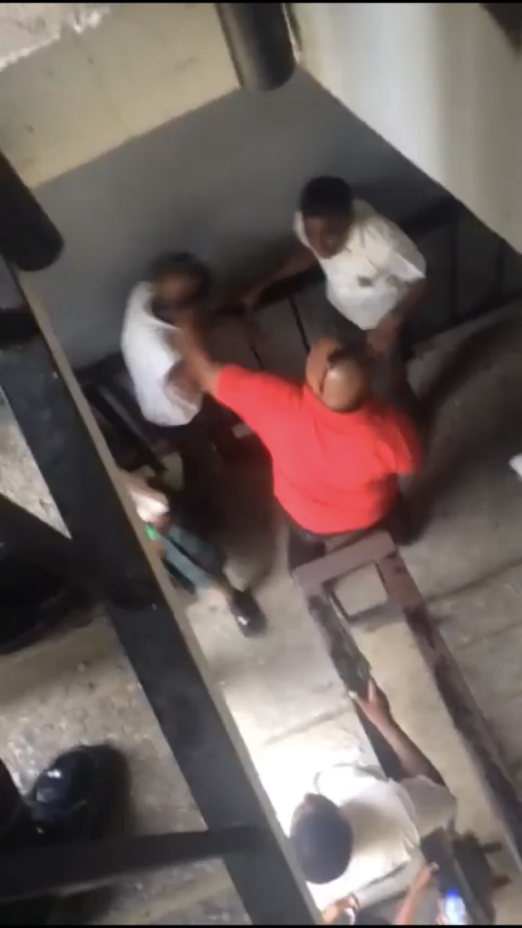 A still from the video circulating social media showing the man intervening in a fight between two students. 
