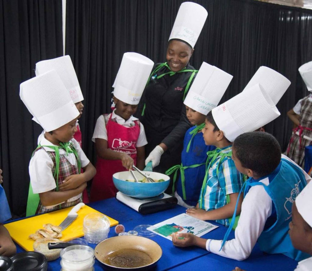 Children learn to cook healthy recipes.