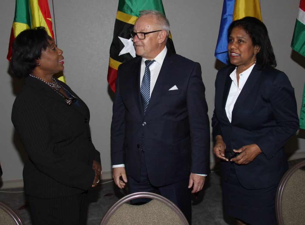 Trade and Industry Minister Paula Gopee-Scoon, right, listens as House Speaker Bridgid Annisette-George makes a point to European Parliament member Boleslaw Piecha yesterday at an EU-Cariforum Parliamentary Committee meeting at the Hyatt Regency in Port of Spain.