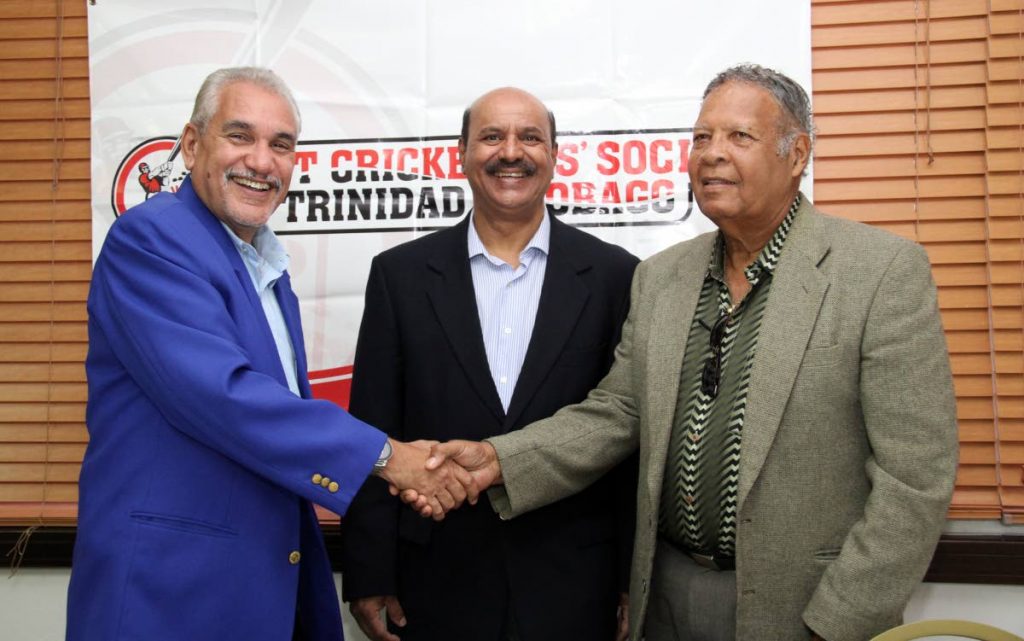 Past Cricketers Socety members Colin Murray, left, Alvin Corneal, right, and Justice Prakash Moosai, centre, chat at the launch of the 2nd annual Cricketers Can Cook at the Queen’s Park Oval, yesterday.