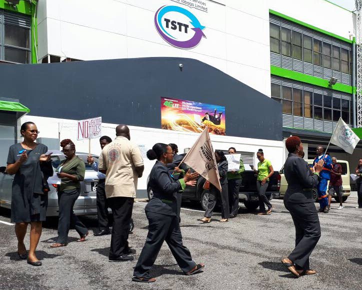 TSTT workers in a midday protest outside the company’s 
St James Street, San Fernando office yesterday.