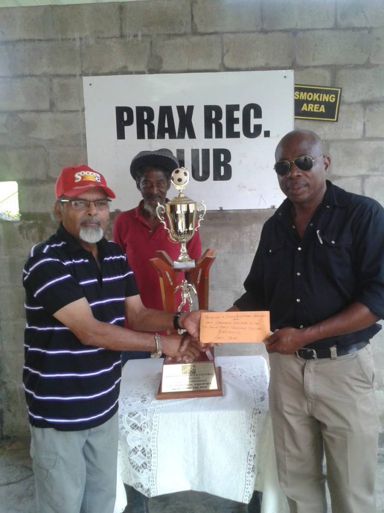 Fishing Pond Football League organiser Prakash Ramkissoon, left, poses with league sponsor Peter Park, Managing Director of Caribbean Welders.