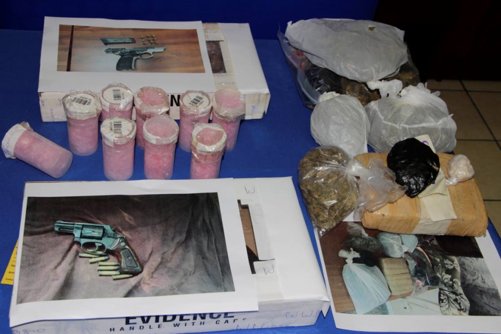  Two guns, and a haul of ammunition and illegal drugs, recovered by police officers in Tobago, are on display at the Scarborough Police Station at a press briefing on Wednesday.