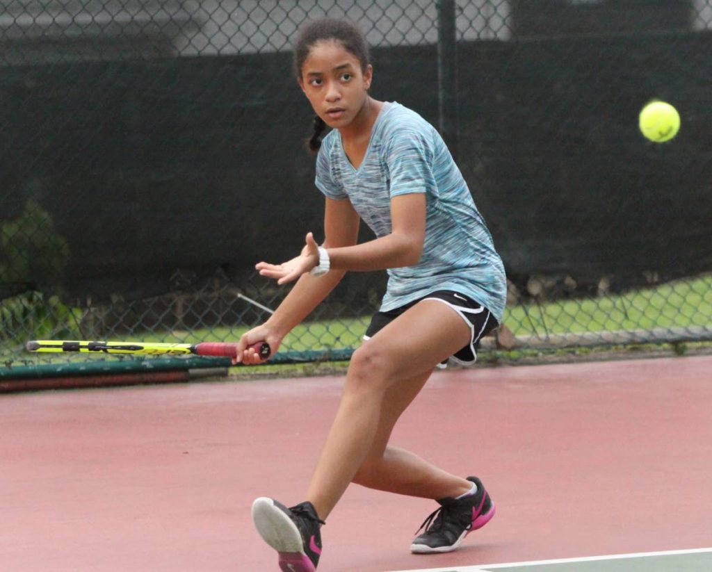 Emily Lawrence playing at the Subway Junior Tennis Championship, Trinidad Country Club, Maraval. Her opponent was Aralia Blackman. PHOTO BY ANGELO M. MARCELLE