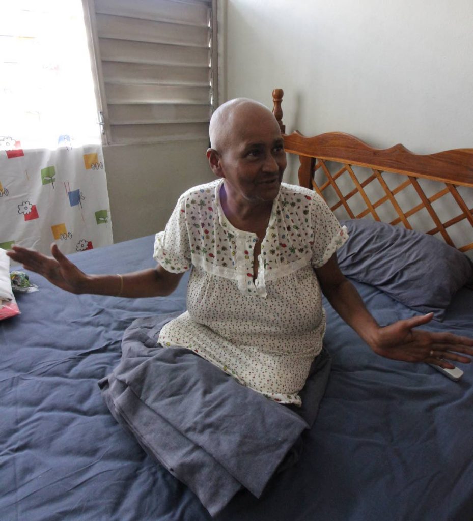 I good: Amputee Erica Joseph is grateful yesterday for the apartment she and her husband now have at Charford Court, Charlotte Street, Port-of-Spain after living under a tent at Queen’s Park Savannah recently. Photo by Roger Jacob