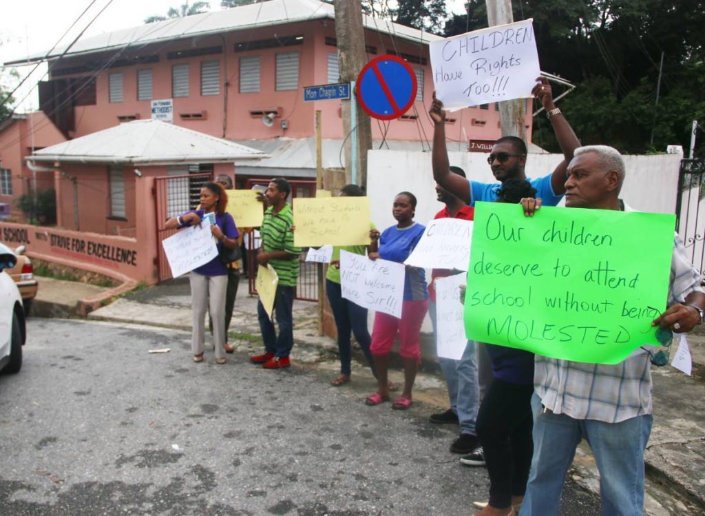 Parents of students attending the San Fernando Methodist School protest last week calling for the removal of a teacher.