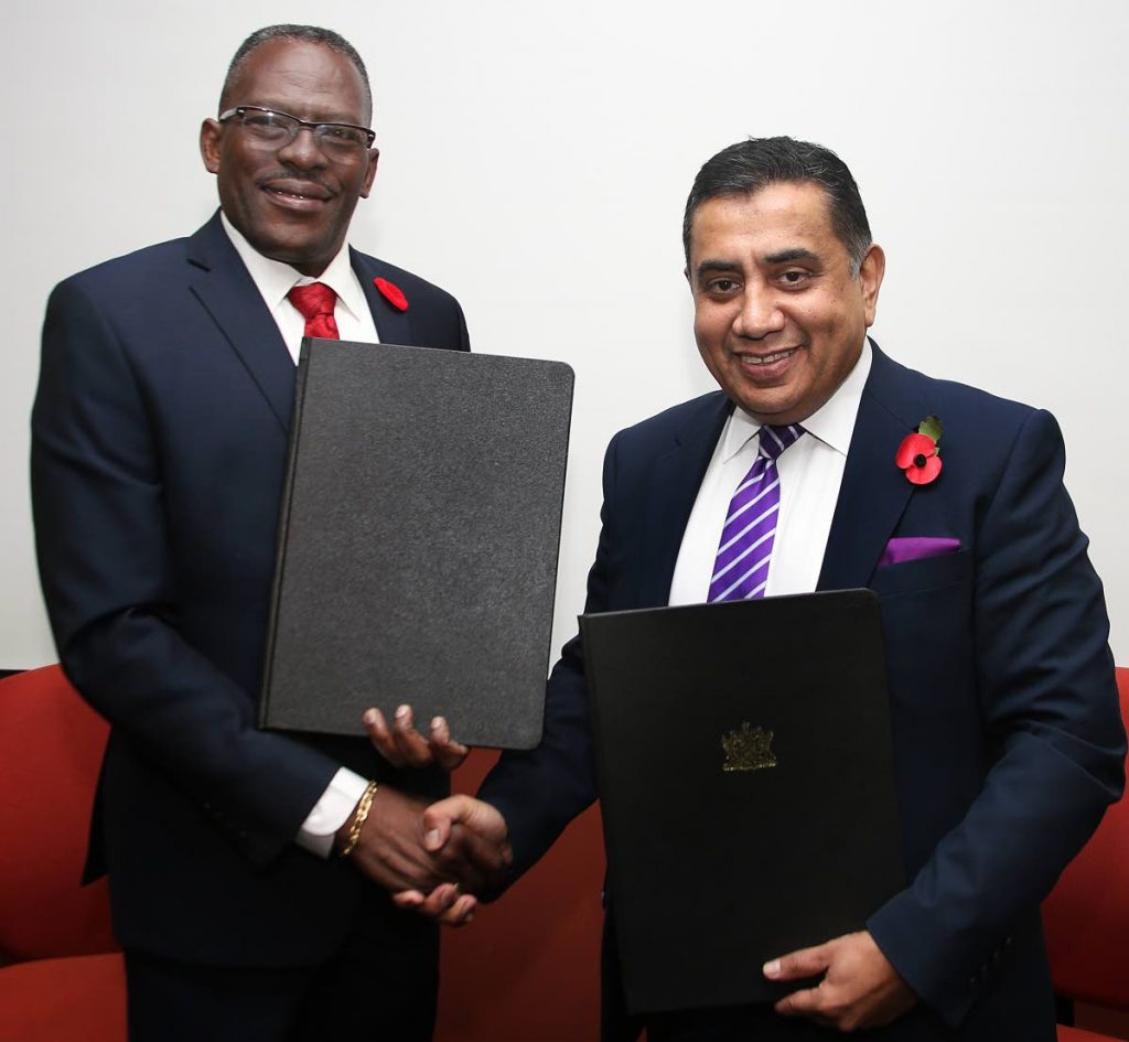 SIGNED: Minister of National Security Edmund Dillion shakes hands with UK Minister of State (Foreign and Commonwealth Office) Lord Ahmad of Wimbledon following the signing of an MOU between  TT and the UK held at the Ministry of National Security offices  at the Int’l Financial Complex, Tower C PoS.