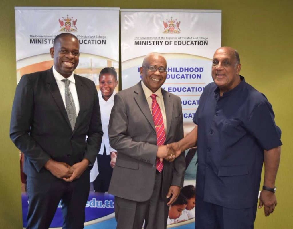 CORDIAL: Education Minister Anthony Garcia shakes hands with UTT Chairman Prof Ken Julien while Minister in the Education Ministry Dr Lovell Francis, looks on following a meeting betweeen Garcia and the UTT Board yesterday.