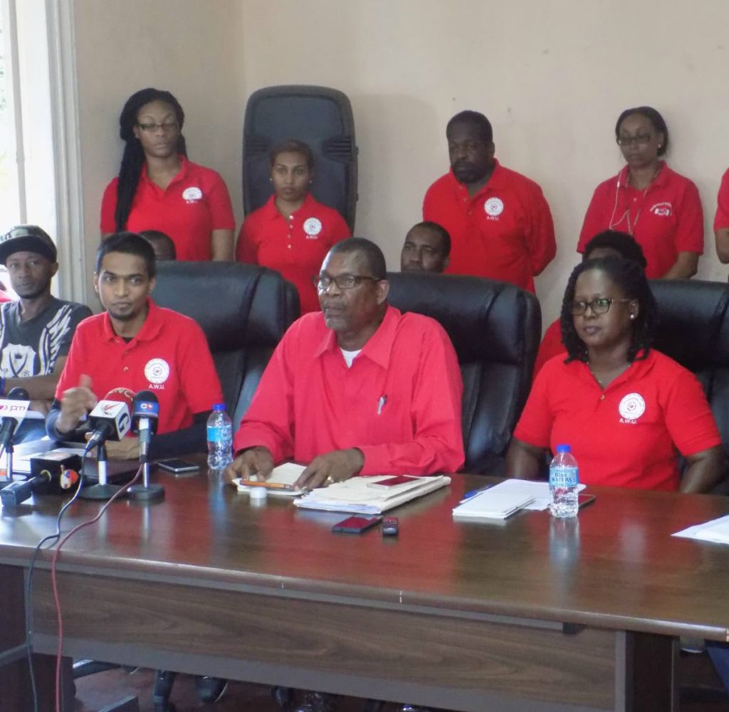 FILE PHOTO: President General of the Amalgamated Workers Union Michael Prentice and General Secretary Cassandra Tommy-Dabreo, speak to reporters during a press conference at the Union's headquarters in Port of Spain.
