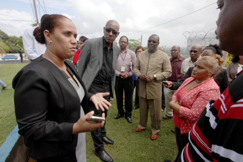 Public Utilities Minister LeHunte and officials of WASA, join the Arima Mayor Lisa Morris Julian, to areas within her district severely impacted by no water supply on Friday. PHOTO BY ROGER JACOB. 
